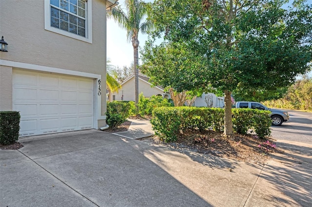 view of side of property featuring a garage