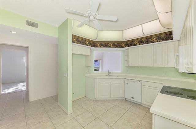 kitchen with white cabinetry, white appliances, sink, and light tile patterned floors