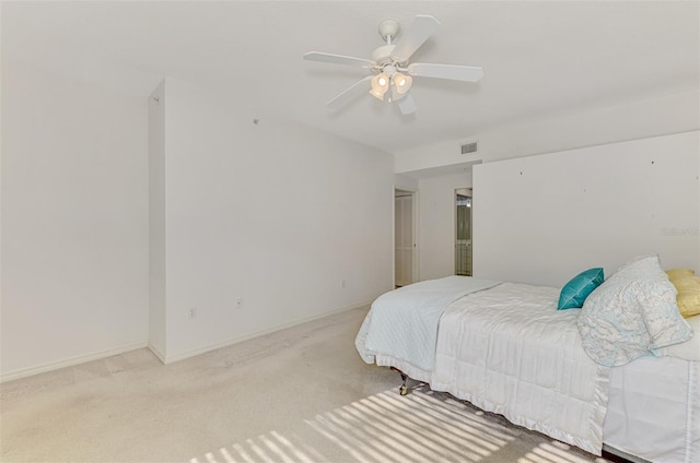 bedroom with light carpet and ceiling fan