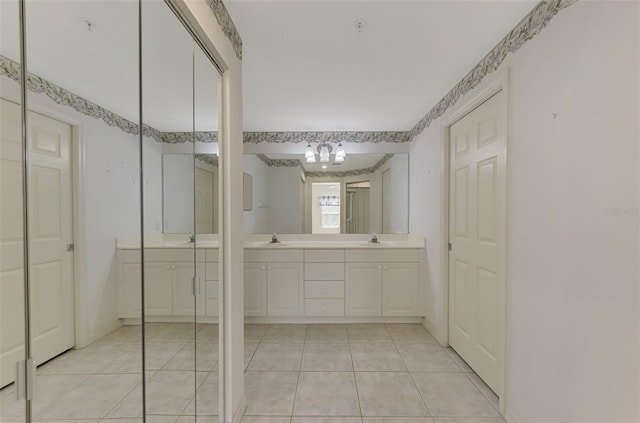 bathroom with vanity and tile patterned flooring