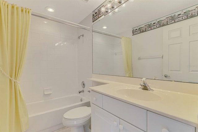 full bathroom with vanity, shower / tub combo, and toilet