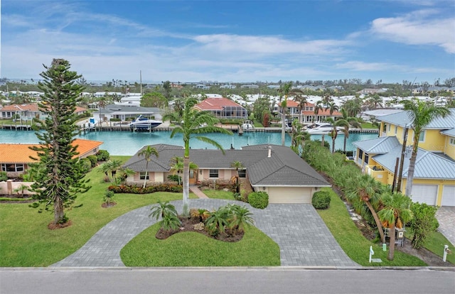 birds eye view of property with a water view