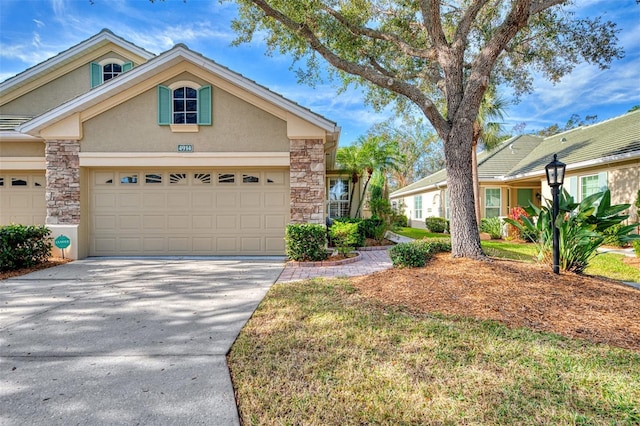 view of front of house with a garage and a front yard