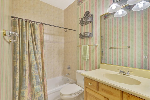 full bathroom with vanity, shower / bath combo with shower curtain, and toilet