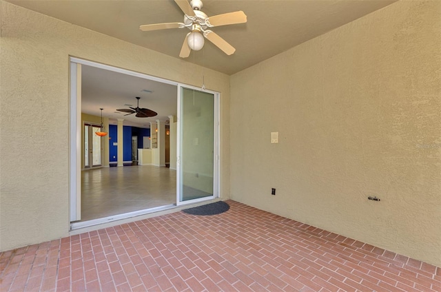 view of patio with ceiling fan