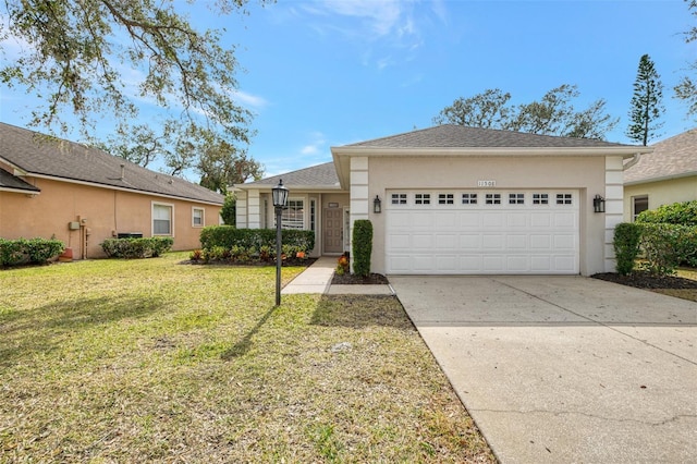 ranch-style home with a garage and a front yard