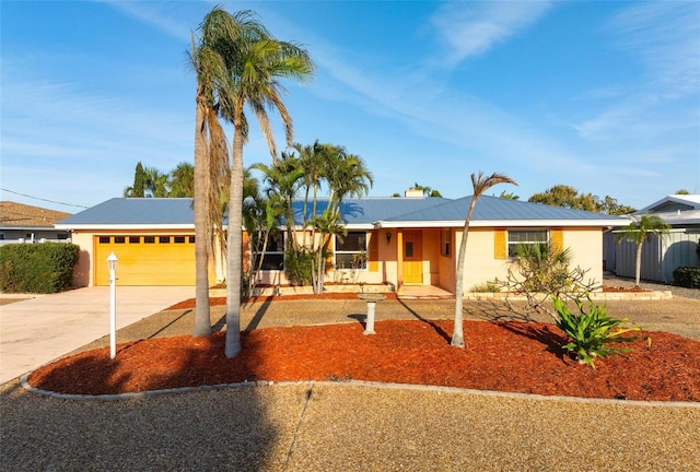 ranch-style home featuring a garage