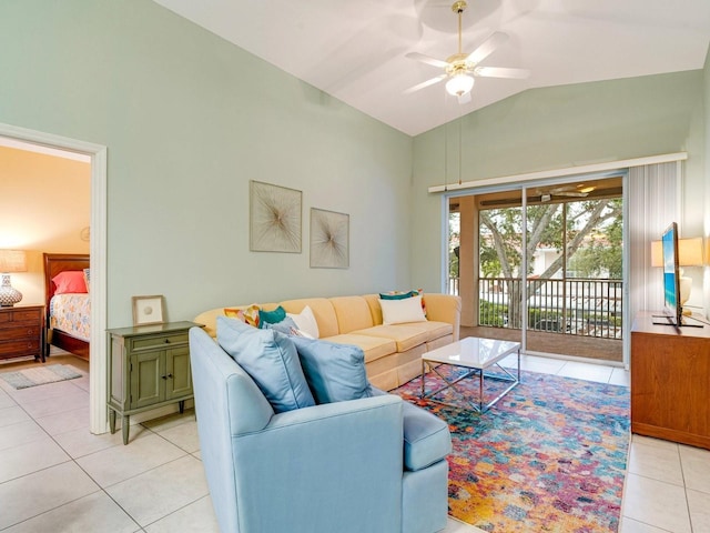 tiled living room featuring ceiling fan and lofted ceiling