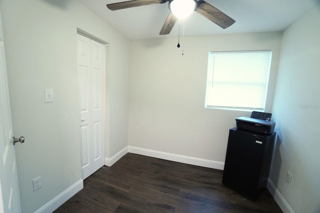 bedroom with ceiling fan, a closet, and dark hardwood / wood-style floors