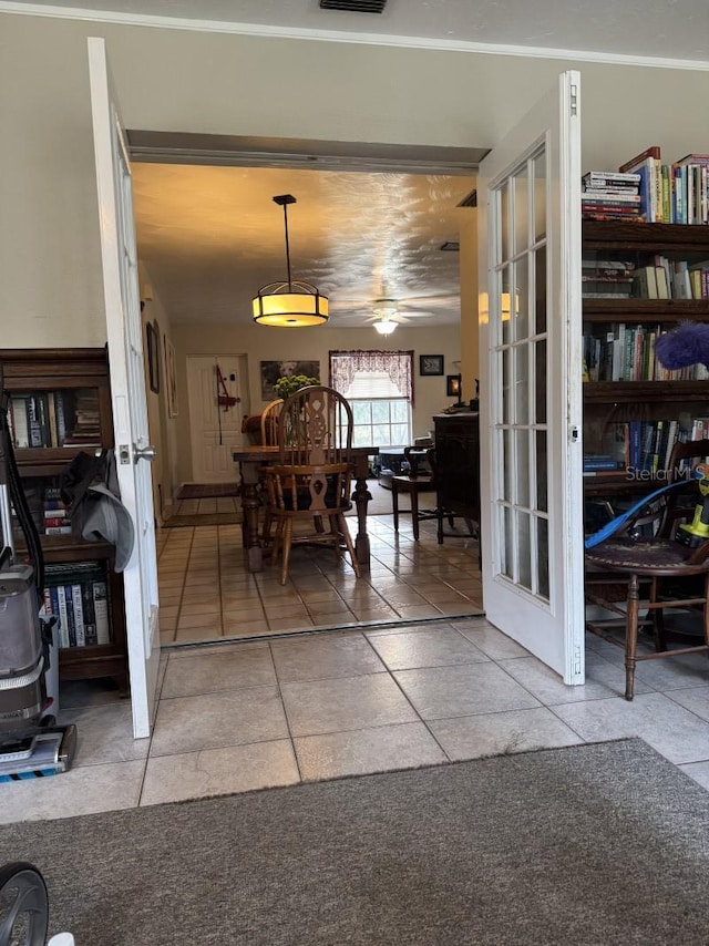 dining space with french doors and tile patterned flooring