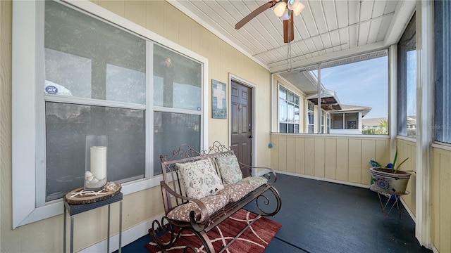 sunroom featuring ceiling fan