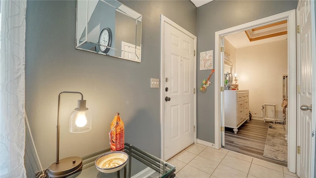 doorway featuring light tile patterned floors