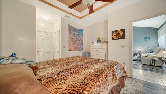 tiled bedroom with ceiling fan