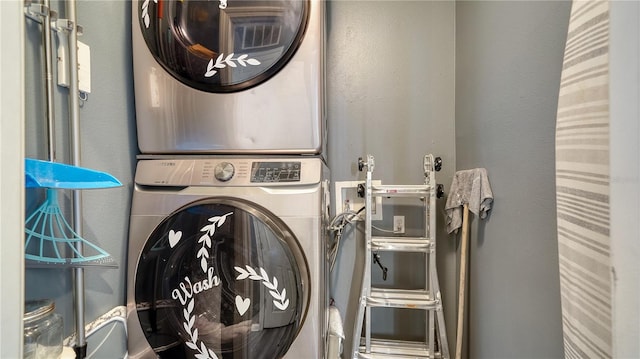 laundry area with stacked washer and dryer