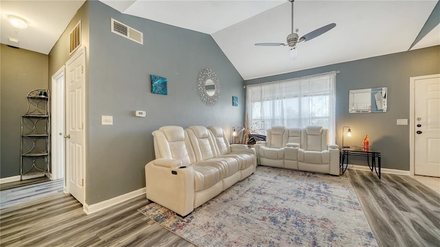 living room with hardwood / wood-style flooring, vaulted ceiling, and ceiling fan