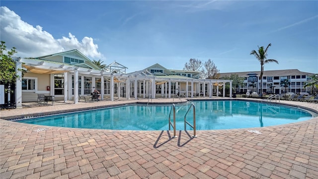 view of pool featuring a pergola and a patio