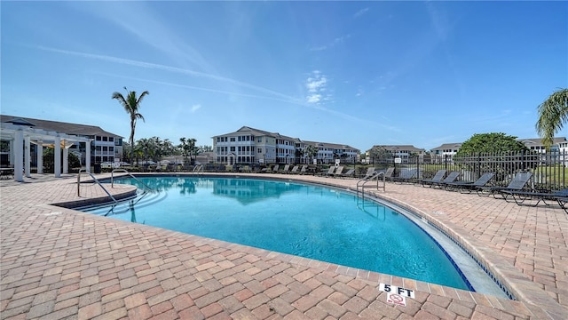 view of pool with a pergola and a patio