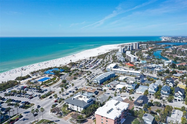 aerial view featuring a view of the beach and a water view