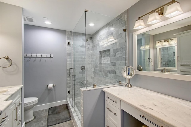 bathroom featuring walk in shower, vanity, and toilet