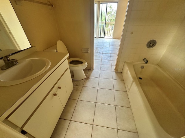 bathroom with vanity, toilet, and tile patterned flooring