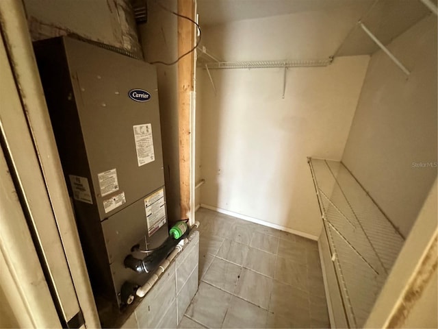 utility room with heating unit