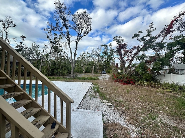 view of yard featuring a fenced in pool