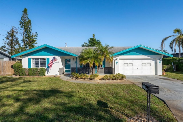 ranch-style home with a garage and a front yard