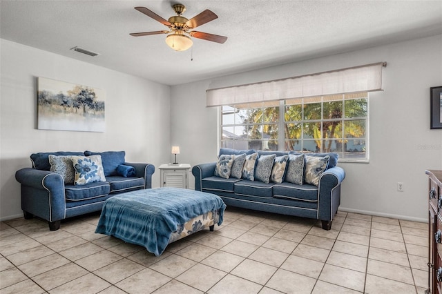 807 62nd St W, Bradenton, FL 34209 - living area featuring plenty of natural light, a ceiling fan, baseboards, and light tile patterned floors