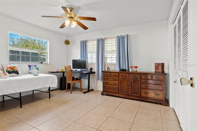 807 62nd St W, Bradenton, FL 34209 - bedroom featuring light tile patterned floors, a closet, and ceiling fan
