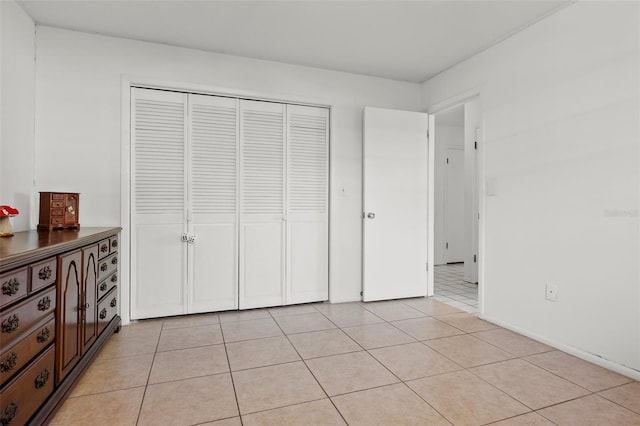807 62nd St W, Bradenton, FL 34209 - unfurnished bedroom with light tile patterned flooring and a closet