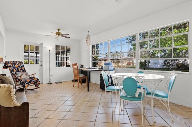 807 62nd St W, Bradenton, FL 34209 - dining space with light tile patterned floors, a ceiling fan, and baseboards