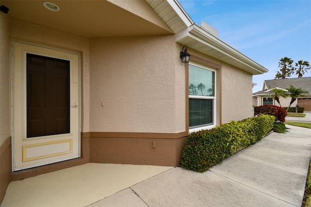 doorway to property featuring a patio area