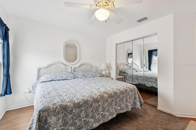 bedroom featuring a closet, ceiling fan, and hardwood / wood-style flooring