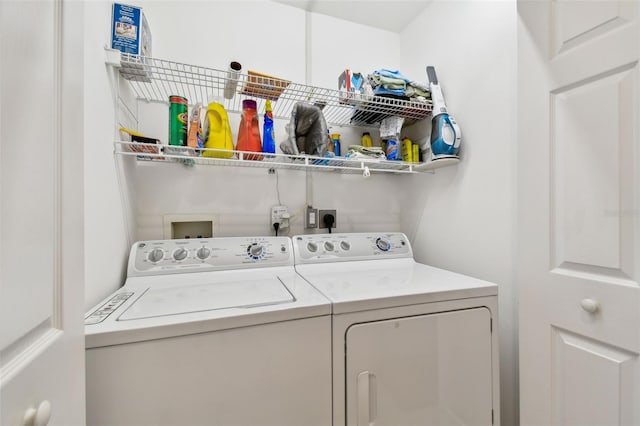 laundry room with independent washer and dryer