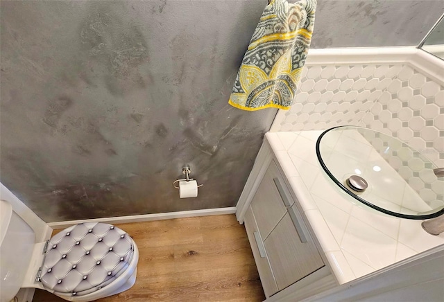 bathroom featuring vanity and hardwood / wood-style floors