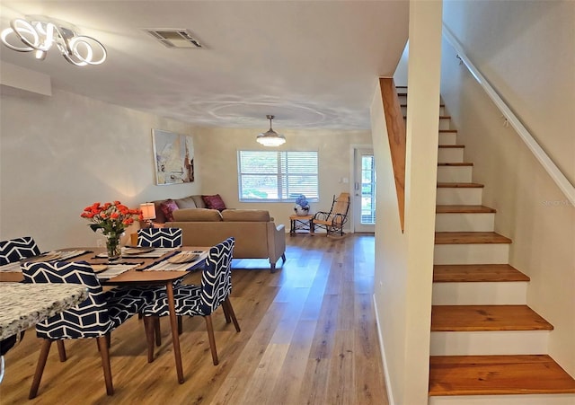 dining room with hardwood / wood-style floors