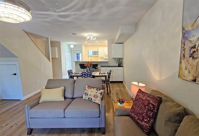 living room with light hardwood / wood-style flooring