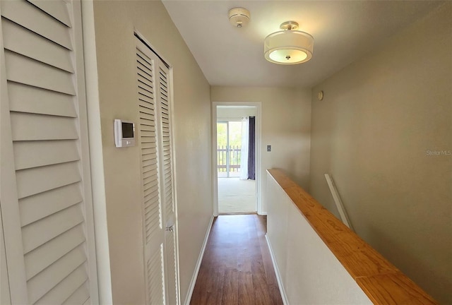 corridor with dark hardwood / wood-style floors