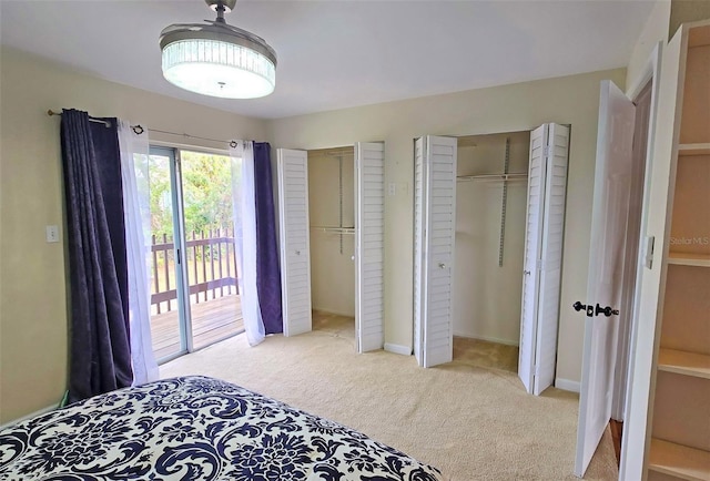 carpeted bedroom with access to exterior and a closet