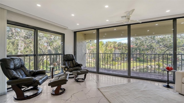 sunroom with ceiling fan