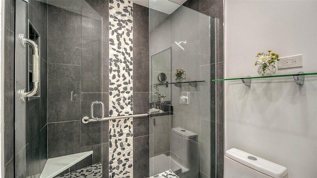 bathroom with walk in shower and toilet