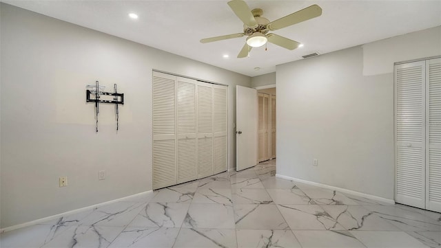 unfurnished bedroom featuring ceiling fan