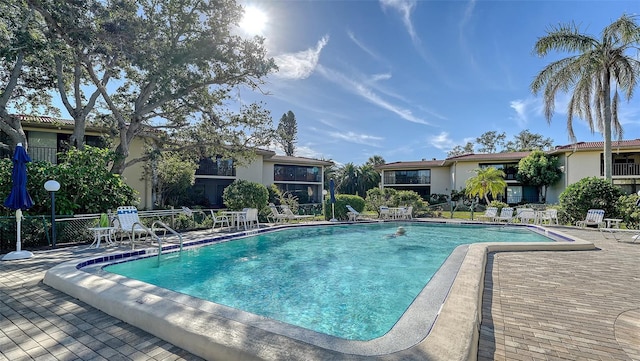 view of swimming pool featuring a patio