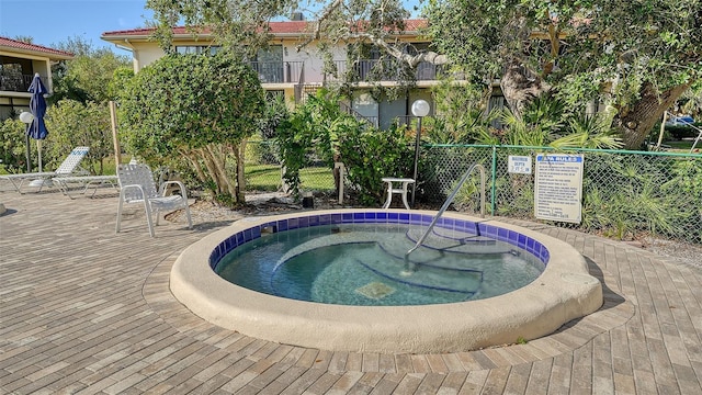 view of pool featuring a community hot tub