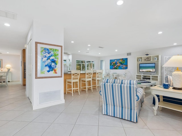 living room featuring light tile patterned flooring