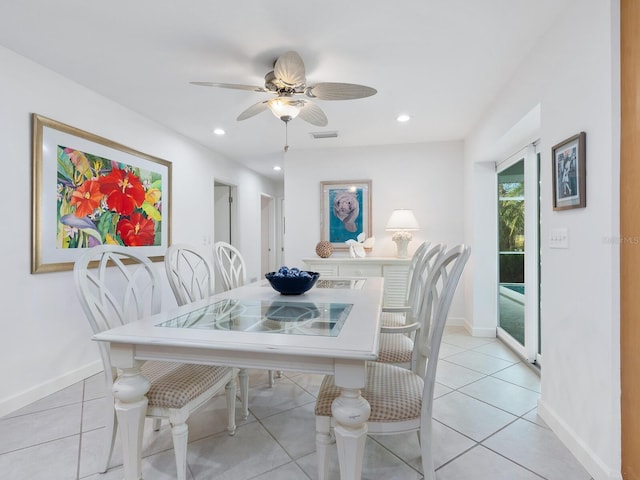 tiled dining area with ceiling fan