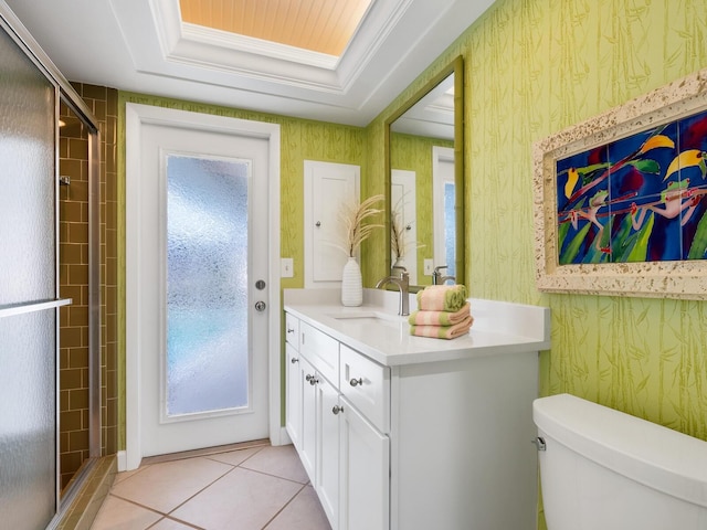 bathroom with vanity, toilet, an enclosed shower, and tile patterned flooring