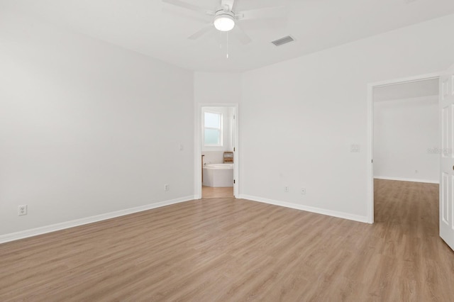 spare room featuring ceiling fan and light hardwood / wood-style floors