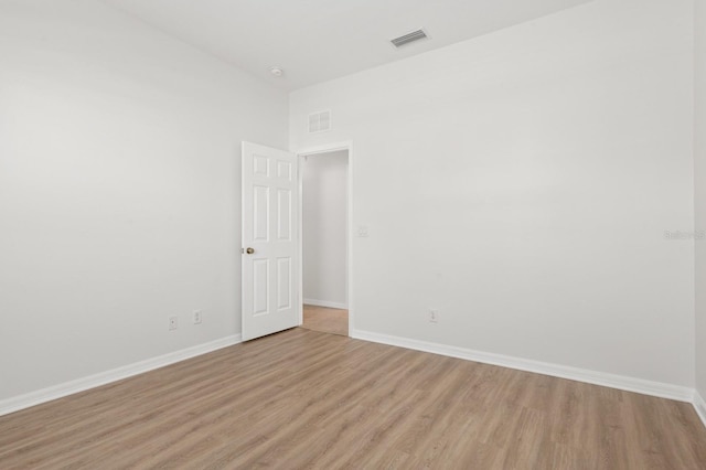 spare room with light hardwood / wood-style floors