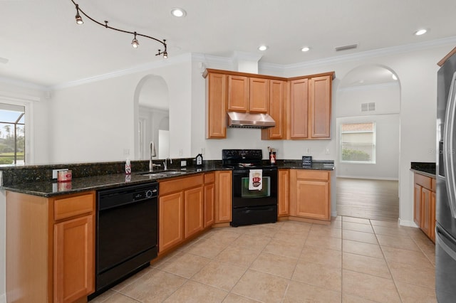 kitchen with sink, light tile patterned floors, dark stone countertops, and black appliances